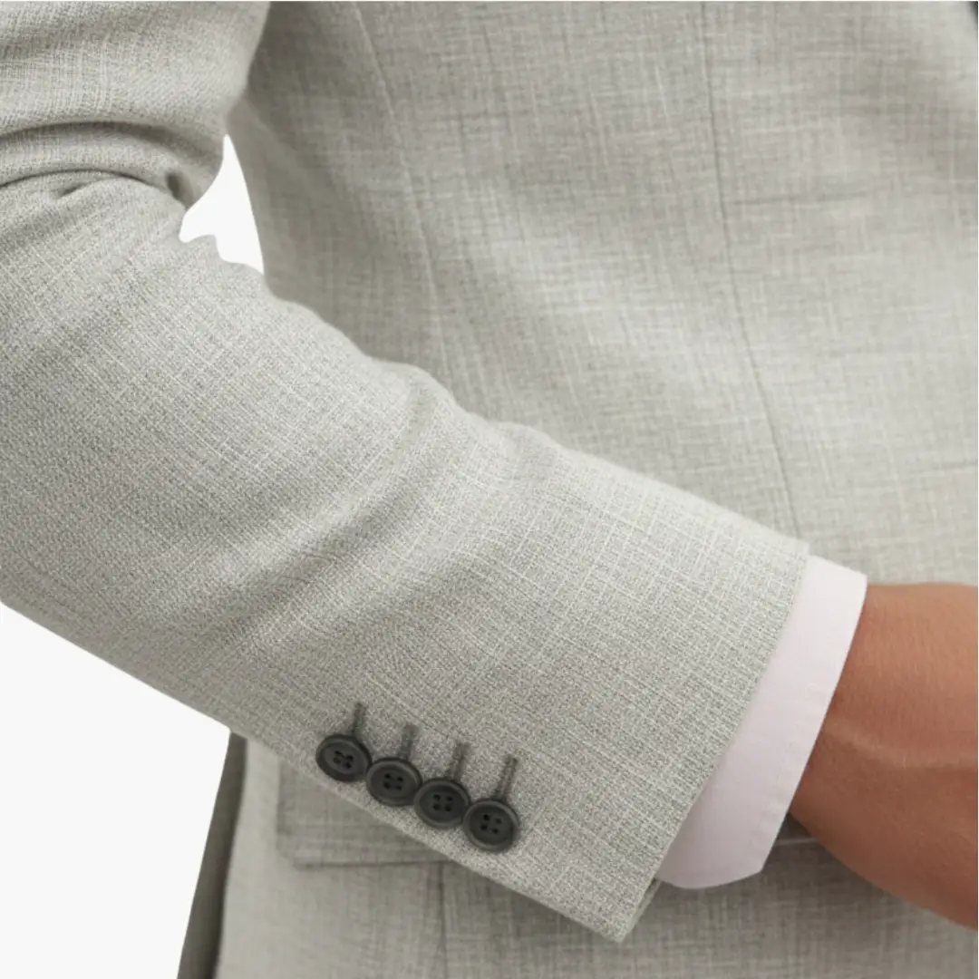 Men's wedding suit sleeve in light gray with four-button cuff and white shirt cuff