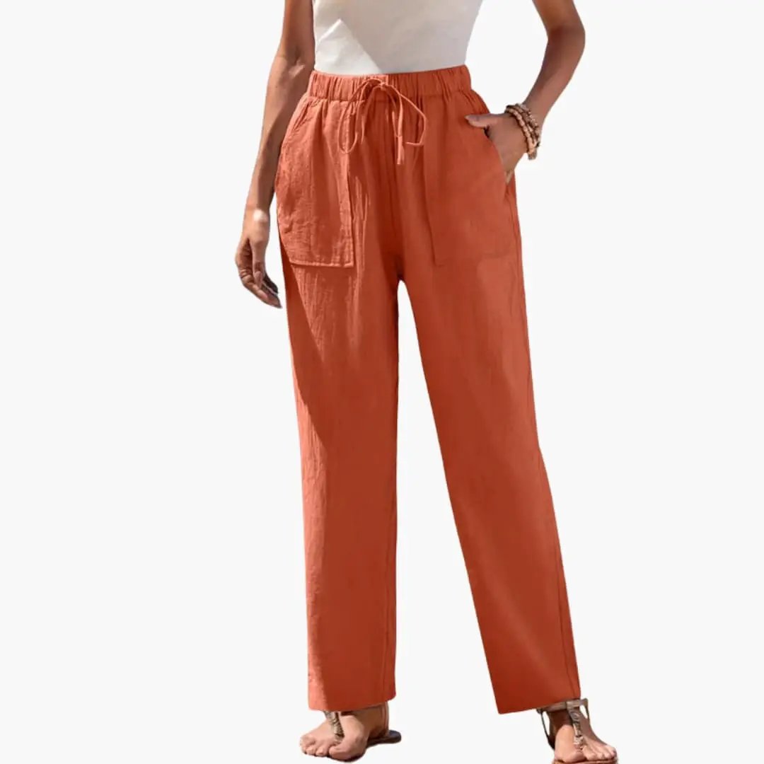 Wilfred Smith Women’s Beach Trousers with elastic waist and side pockets in coral orange, wide-leg.