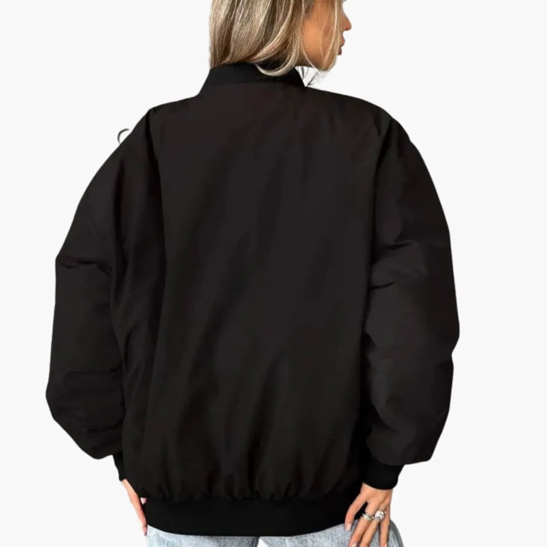 Women's black padded bomber jacket with ribbed elastic cuffs and hem, back view.