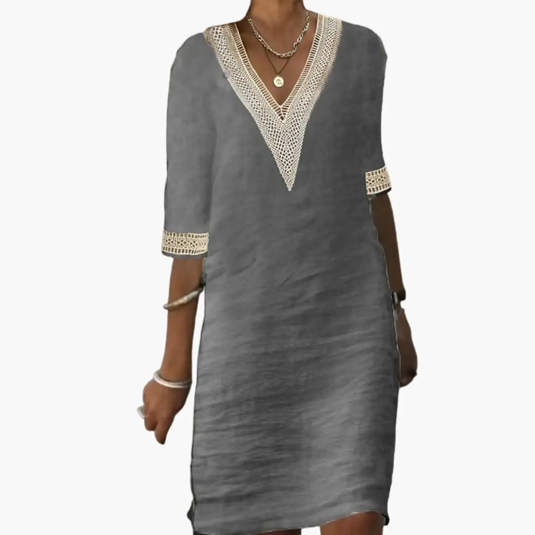 Women’s dress by Wilfred Smith, gray button-front waist dress with crochet-trim V-neck and short sleeves.