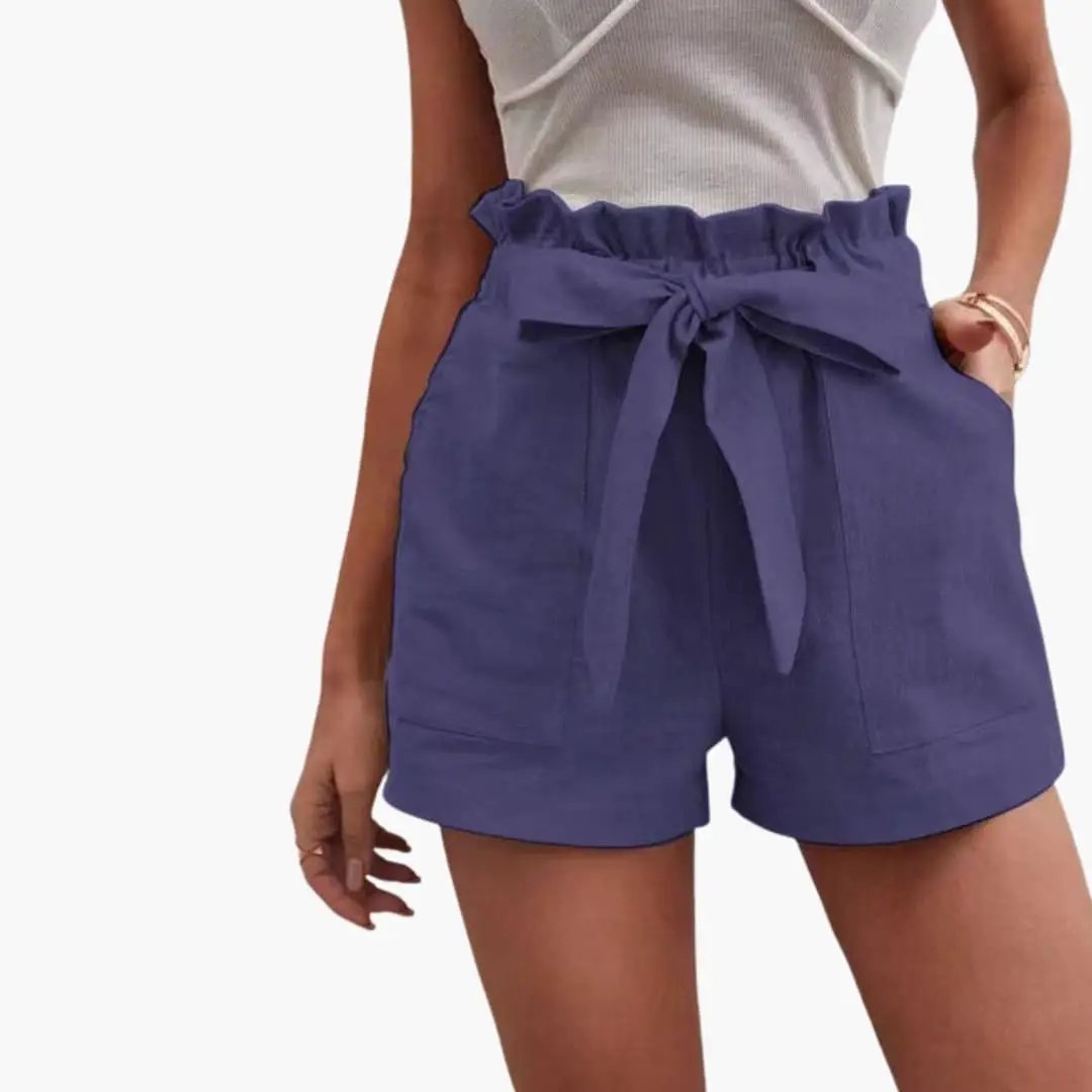 Women's high-waisted shorts by Wilfred Smith in purple with drawstring waist and pockets.