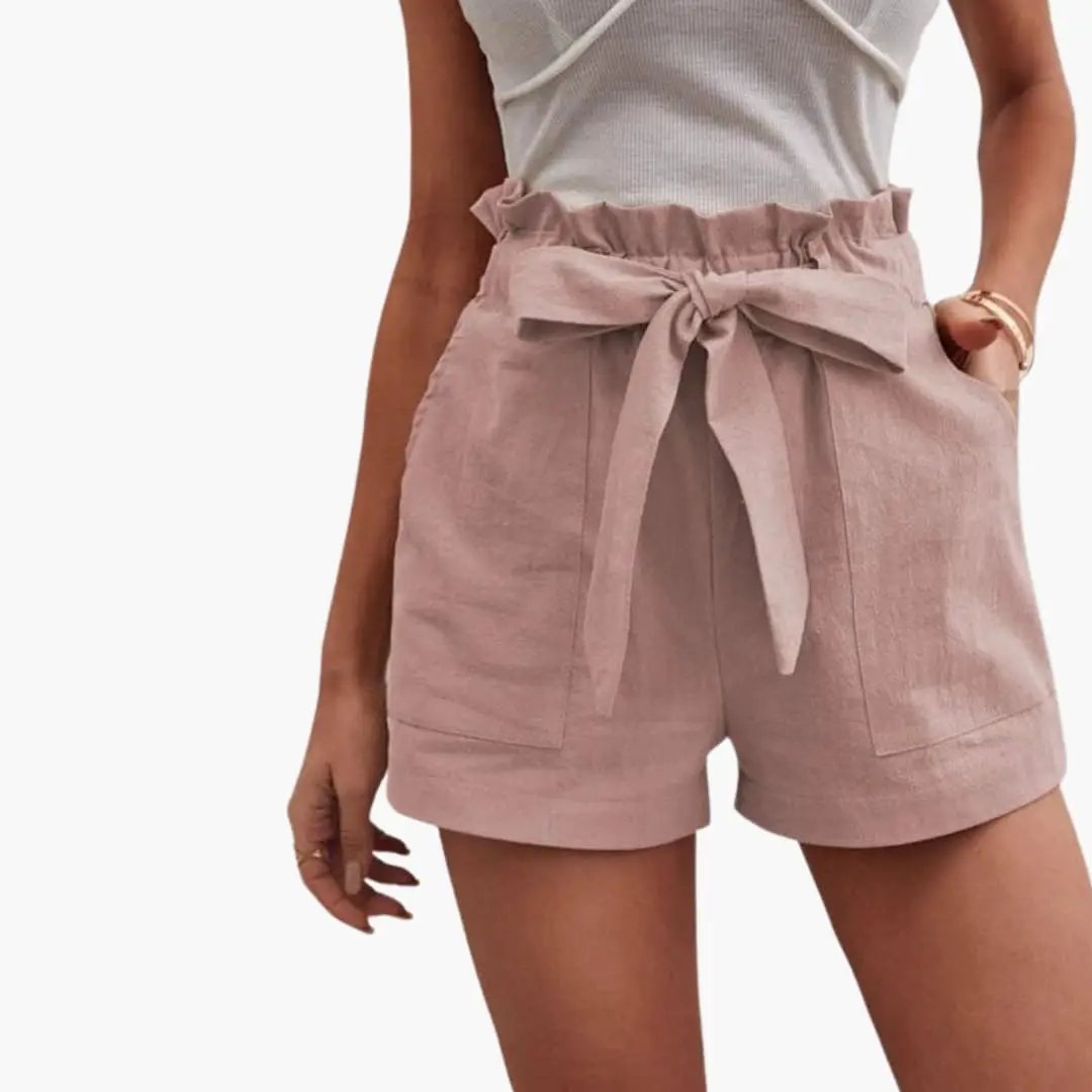 Women's high-waisted shorts in dusty pink with a drawstring waist and front pockets.
