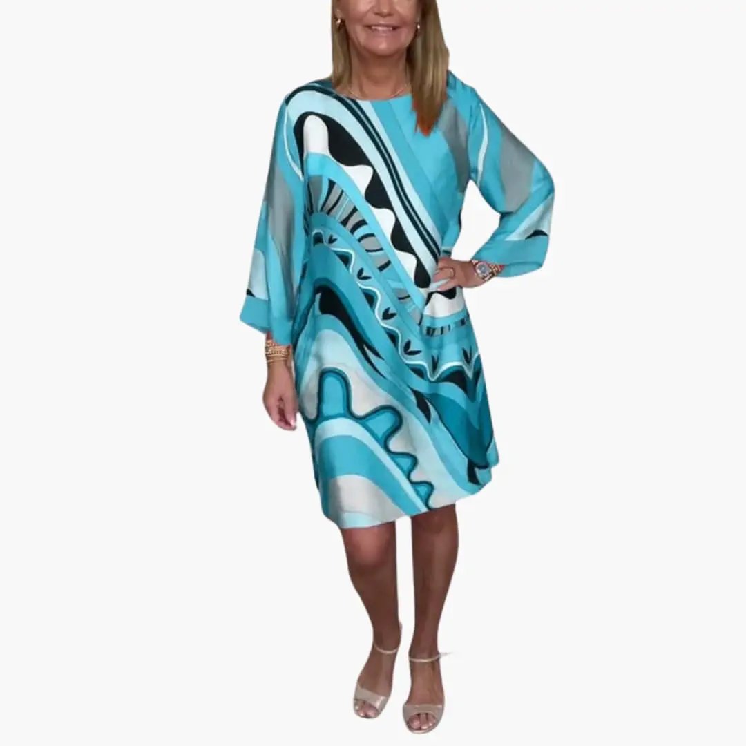 Women's long sleeve printed dress in turquoise blue with abstract pattern, loose fit.
