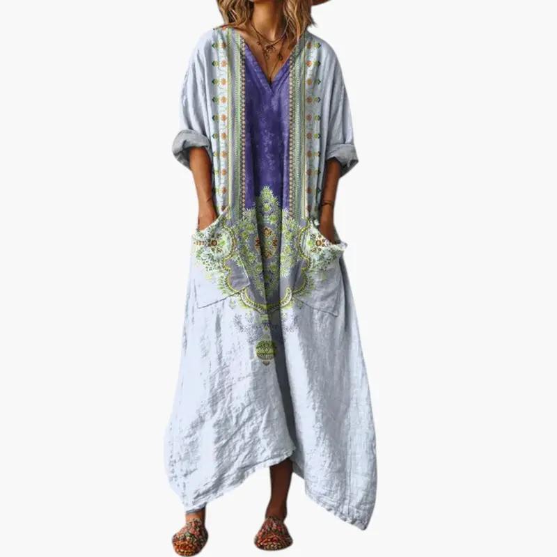 Women's maxi dress with pockets and embroidery, light blue fabric with purple embroidery accents