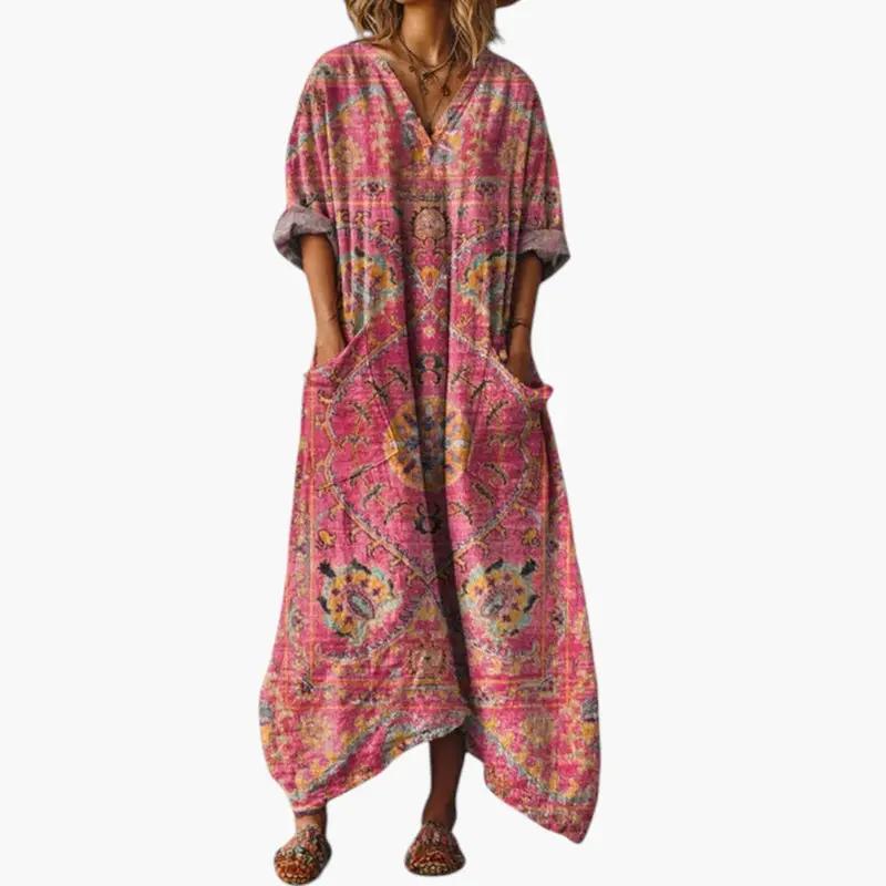 Women's maxi dress with pink embroidery and pockets by Wilfred Smith