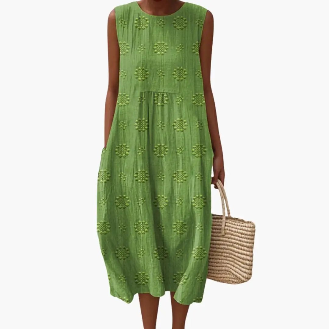 Women's green sleeveless maxi dress with side pockets and embroidered dot motifs by Wilfred Smith