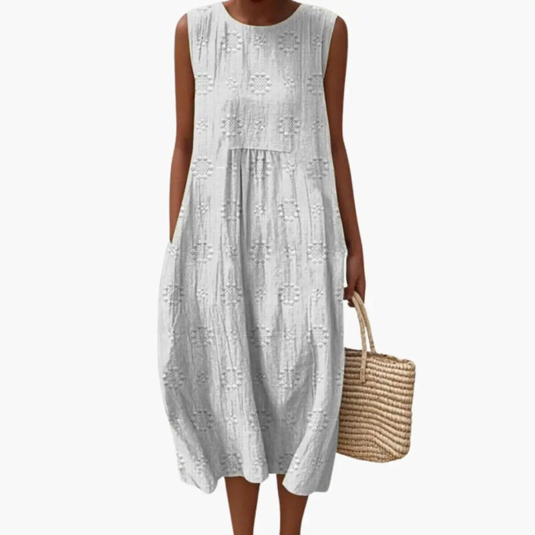 Women's sleeveless maxi dress in light gray with embroidered eyelet floral pattern and side pockets