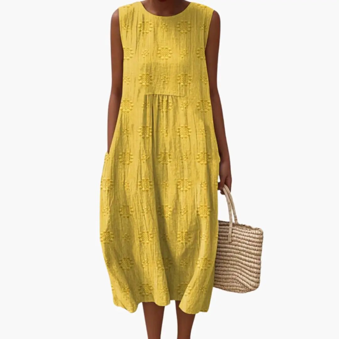 Women's sleeveless yellow maxi dress with side pockets and embroidered eyelet pattern