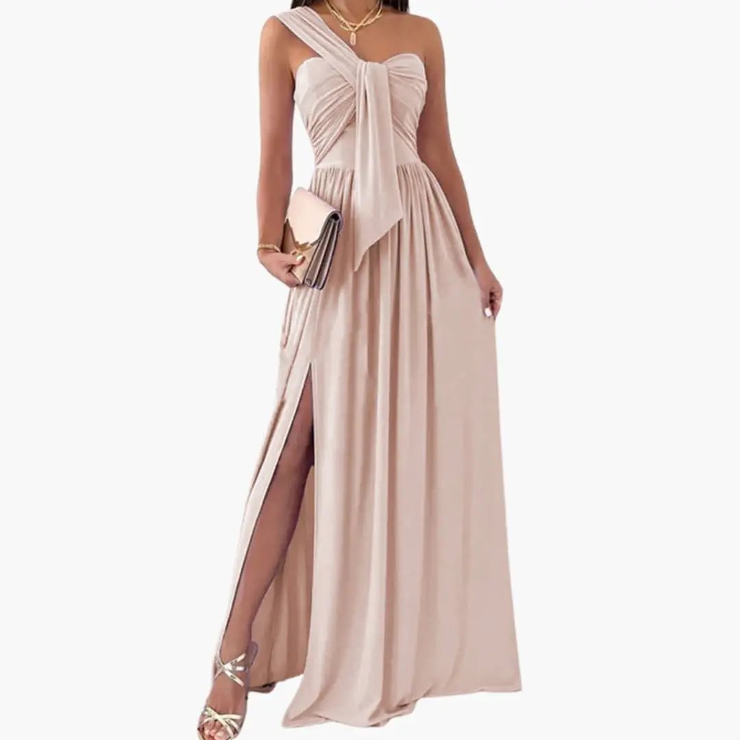Women’s one-shoulder dress in blush pink satin, floor-length with asymmetrical hem and side slit.