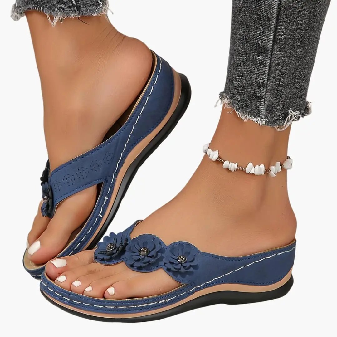 Women's orthopedic sandals by Wilfred Smith, blue slip-on with cushioned insole and floral-embellished toe strap