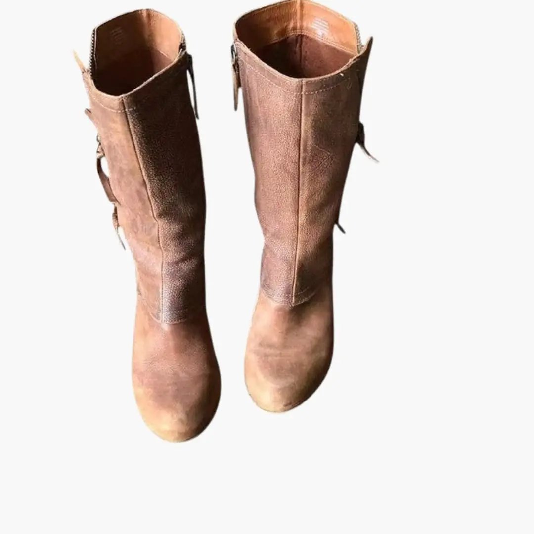 Pair of women's orthopedic boots in tan leather with pull tabs and a structured sole