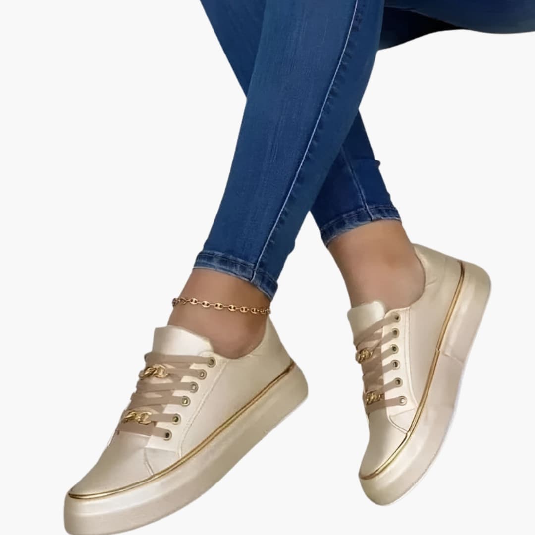Women's orthopedic sneakers in cream with lace-up closure, gold-tone eyelets, and cushioned sole