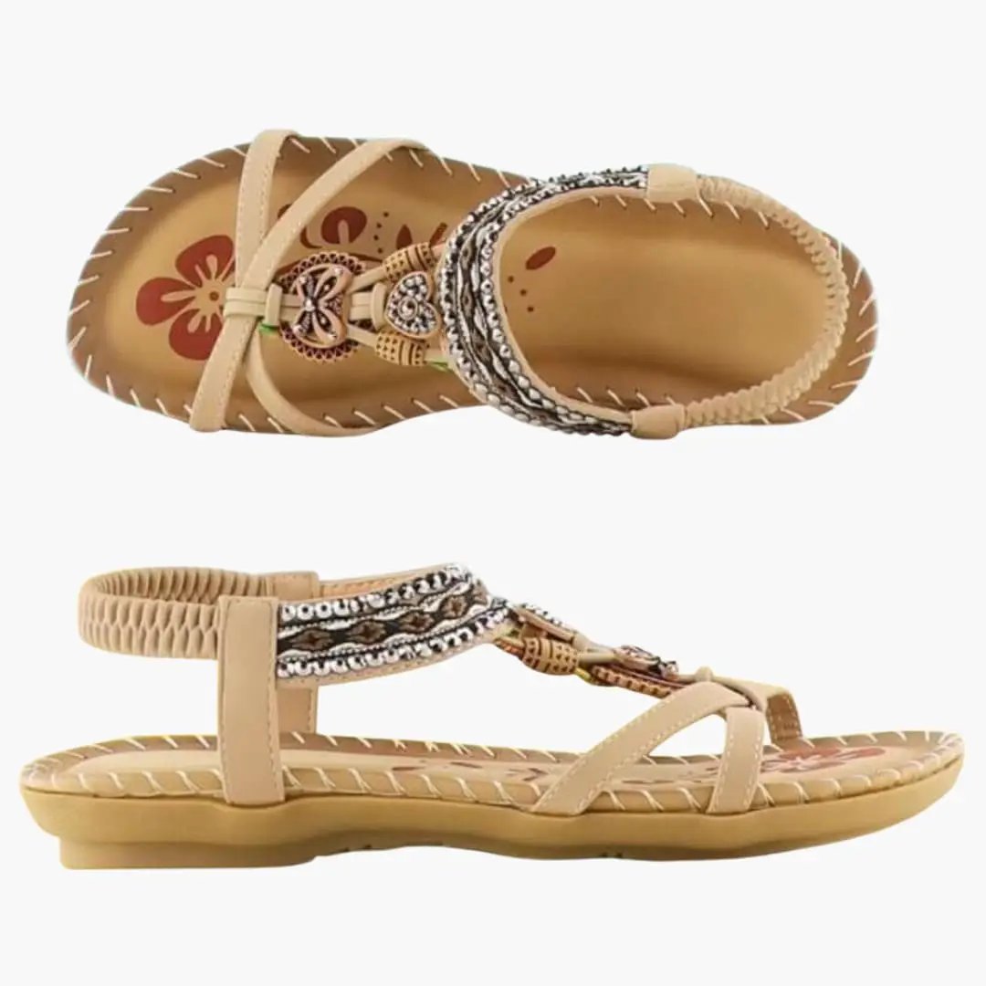 Wilfred Smith women's platform sandals with elastic straps and cushioned sole in tan with beaded braided detail.