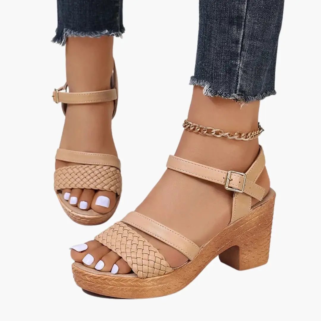 Pair of beige platform sandals with woven toe strap and ankle buckle