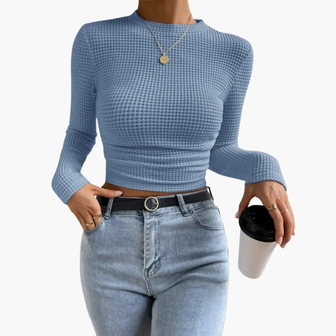 Women's ribbed long sleeve crop top in light blue with a cropped hem.