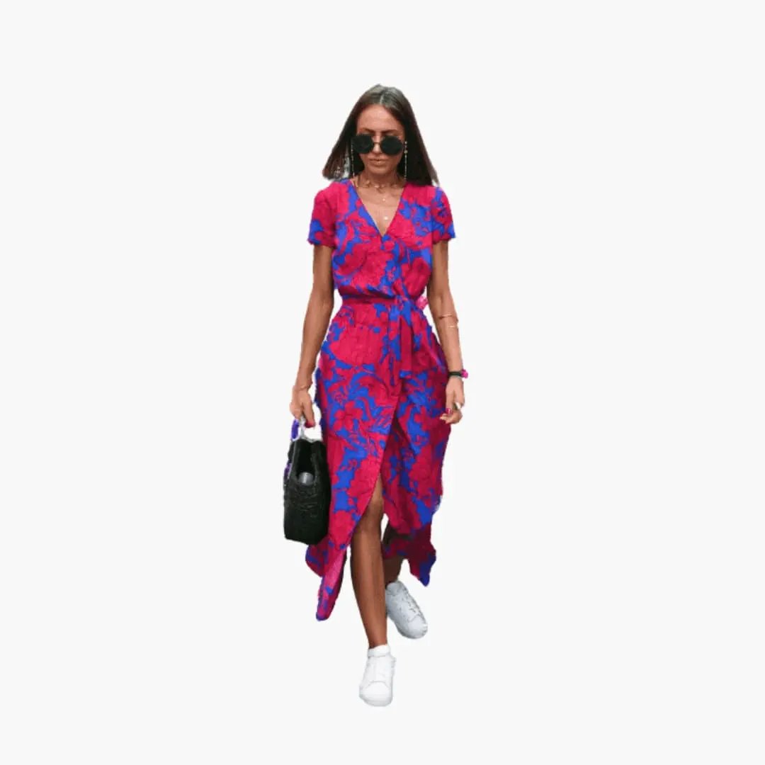 Women's round-neck dress in pink and blue pattern with a tied waist.
