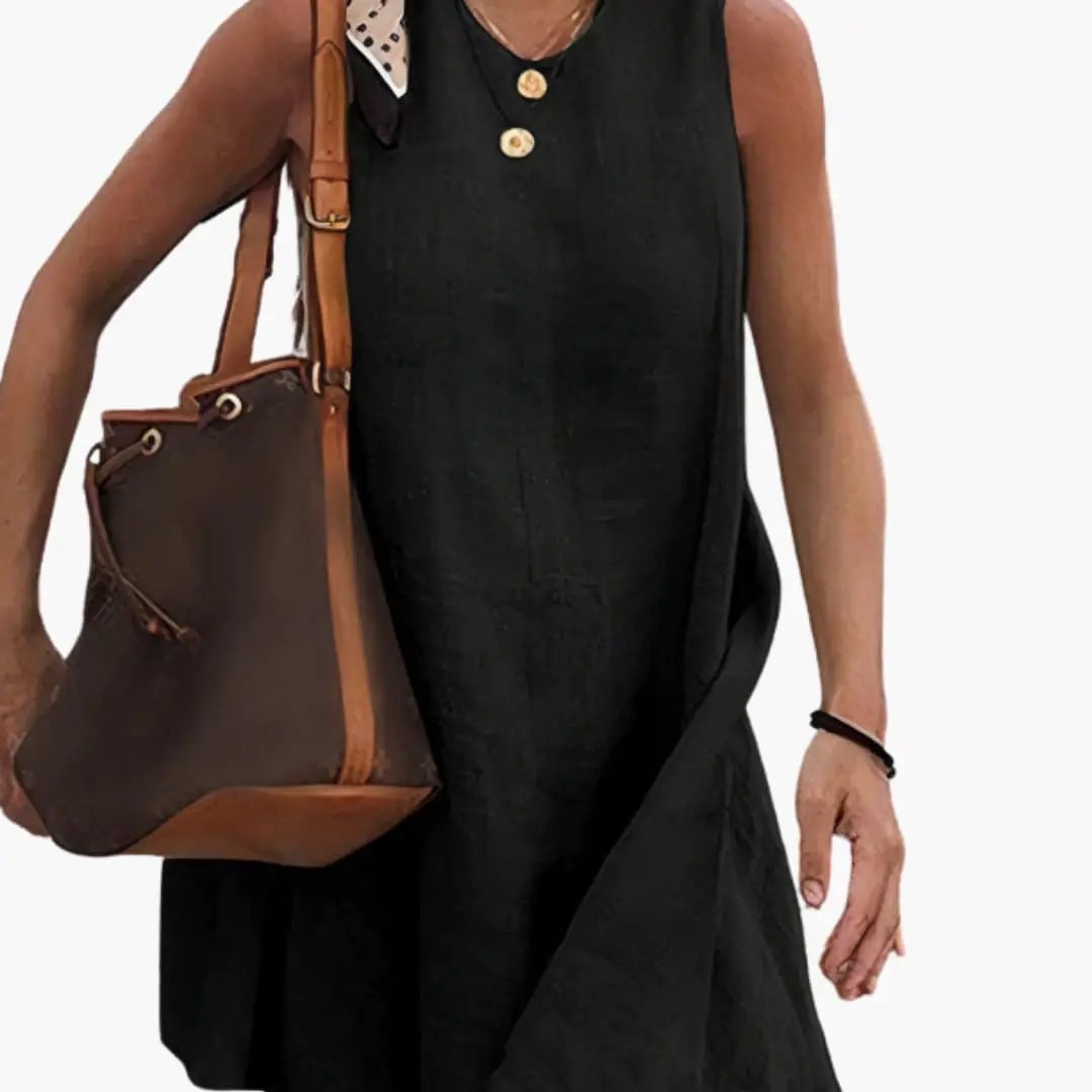 Women’s short button-front black shirt dress with collared neck, shown with a brown leather handbag