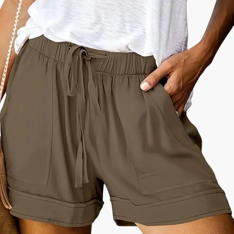 Women's olive-green Wilfred Smith jogger shorts with drawstring waistband, convenient pockets, and relaxed fit.