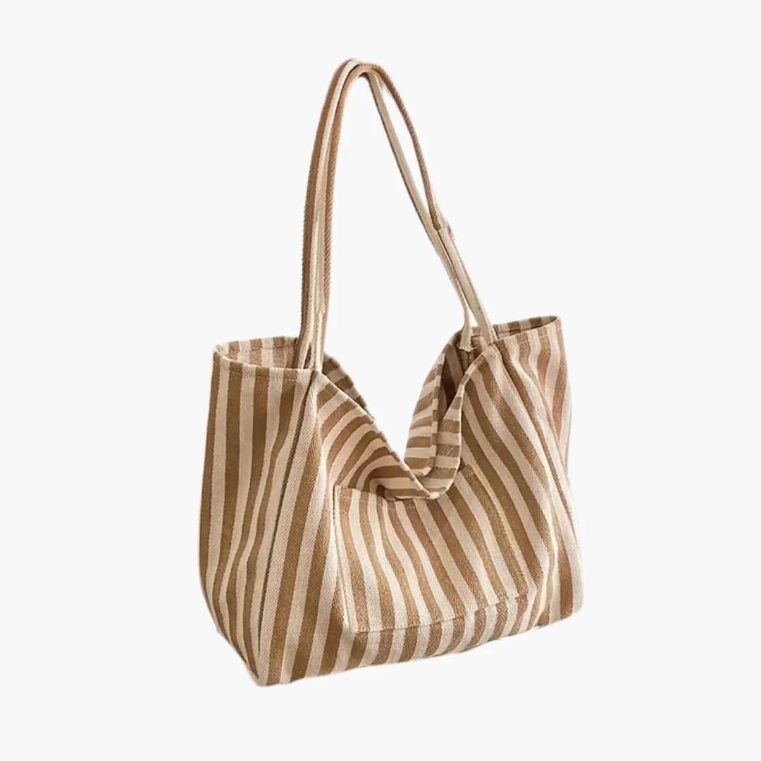 Women's shoulder bag in beige and white striped fabric with large capacity.