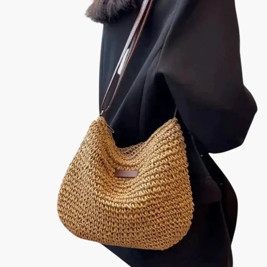 Women's shoulder bag with textured straw weave and adjustable strap, Wilfred Smith.