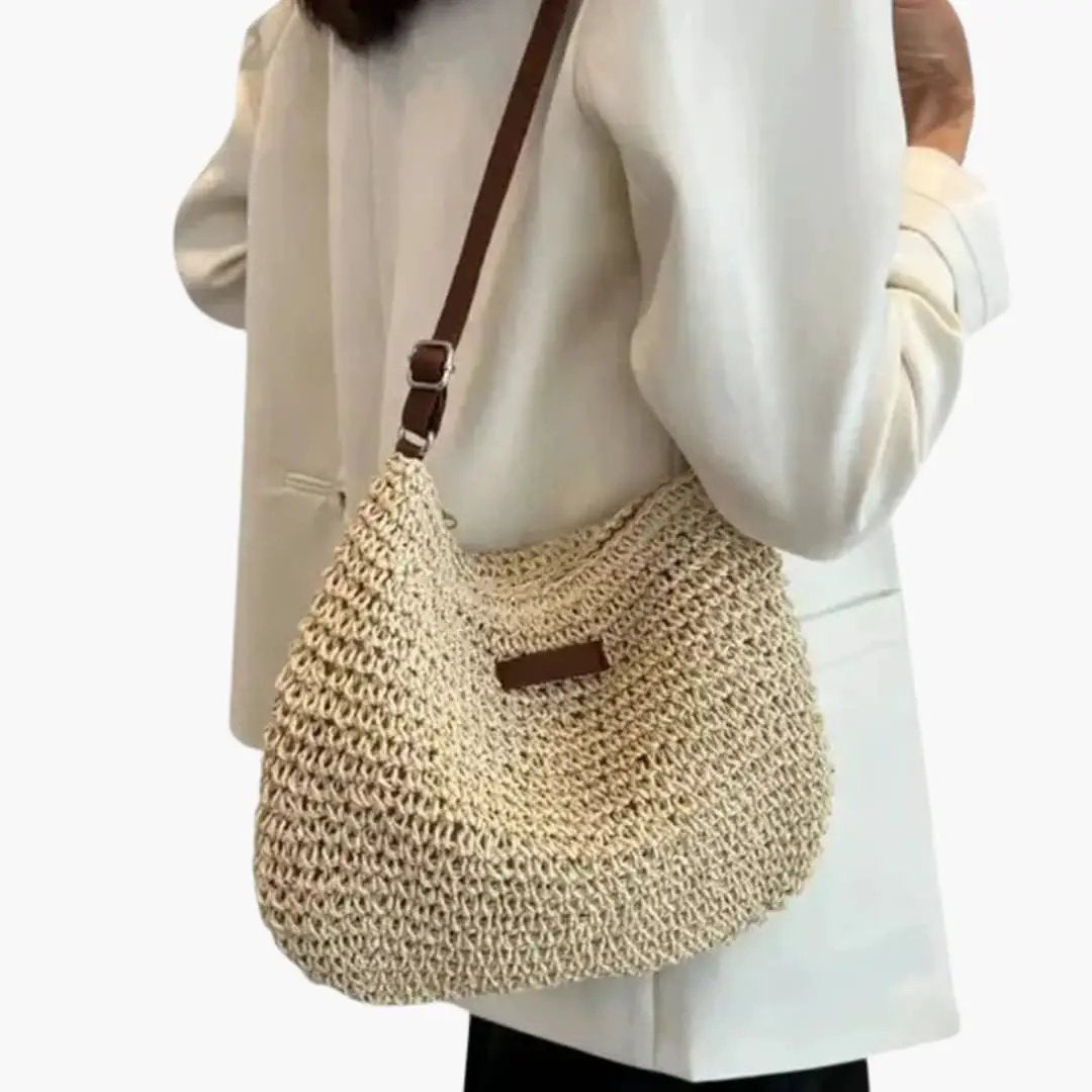 Women's Shoulder Bag by Wilfred Smith, textured natural beige weave with an adjustable brown leather strap.
