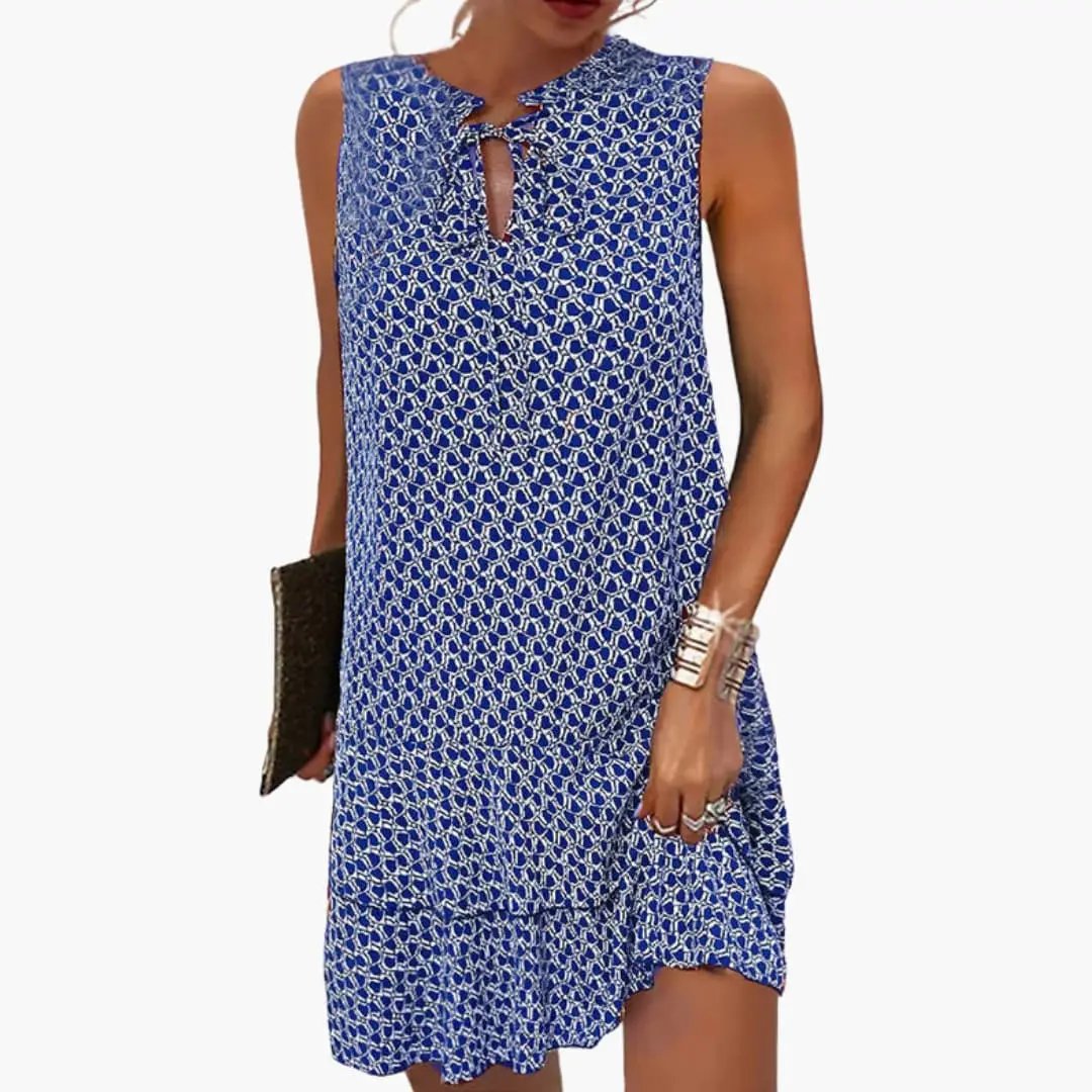 Women's sleeveless dress in blue with tie-front neckline and abstract print