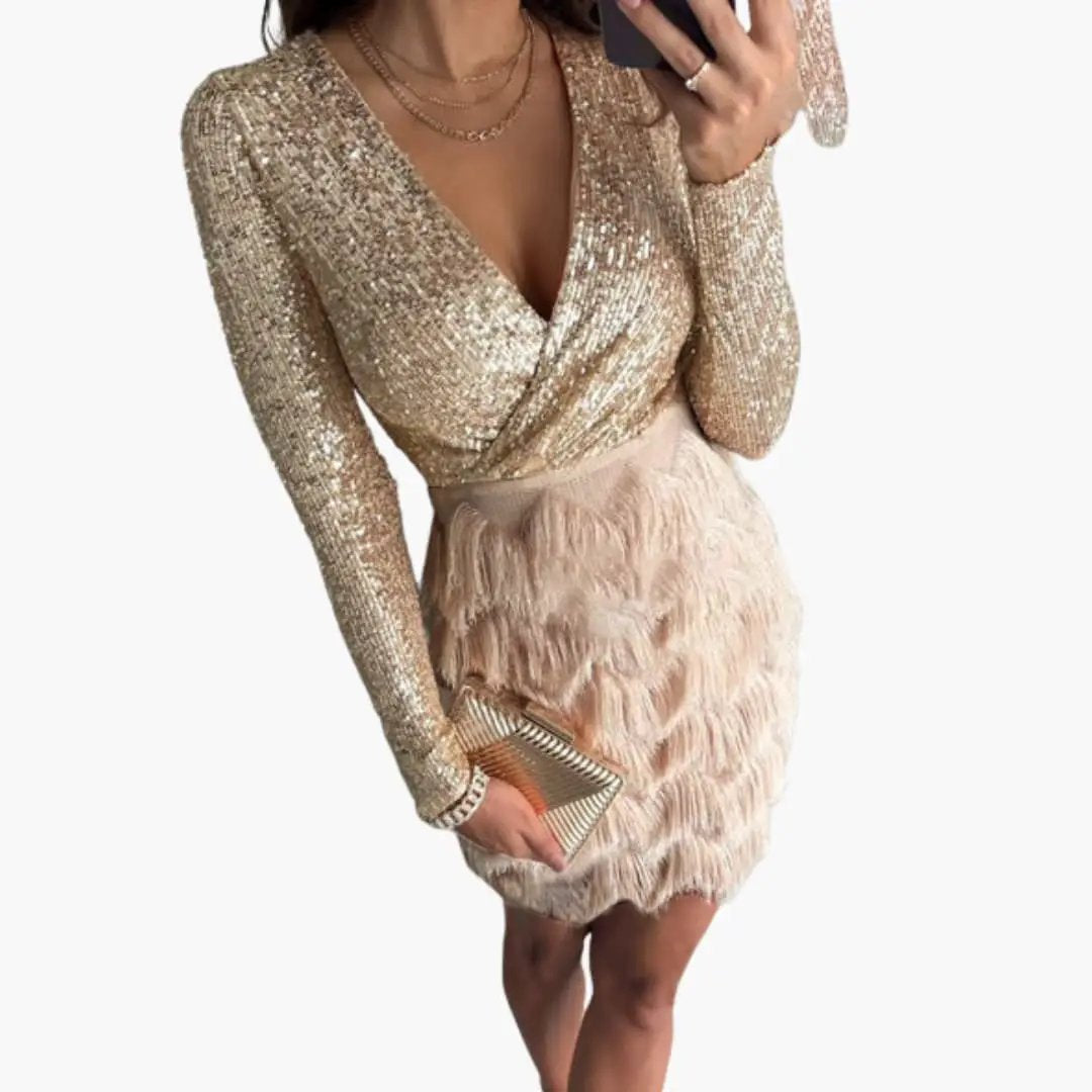 Women’s party dress with gold sequin long-sleeve bodice and blush pink fringe skirt