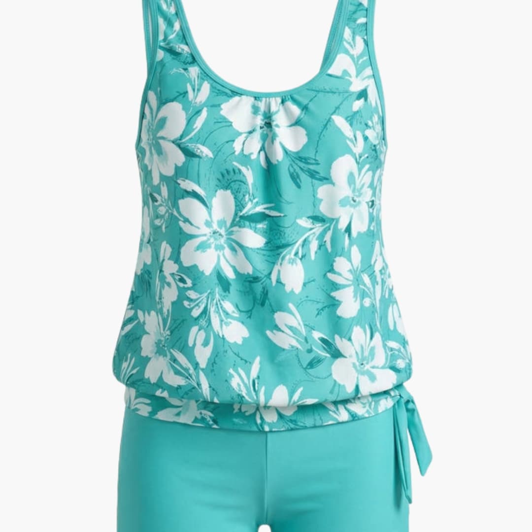 Women’s Sleeveless Tankini Set in teal floral print with solid teal bottoms by Wilfred Smith