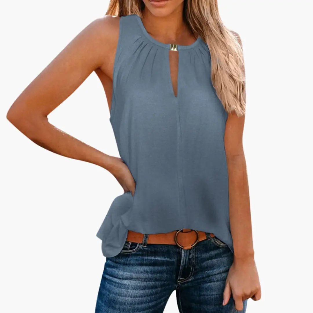 Women’s sleeveless top in blue with decorative pleated neckline and front keyhole detail.