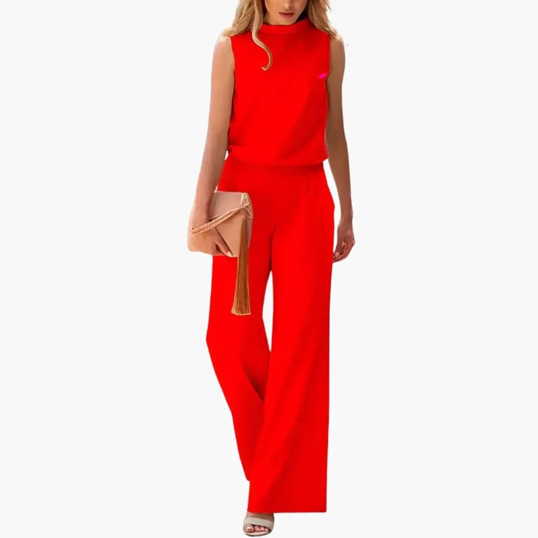 Women’s sleeveless red wide-leg jumpsuit by Wilfred Smith, minimalist one-piece design.