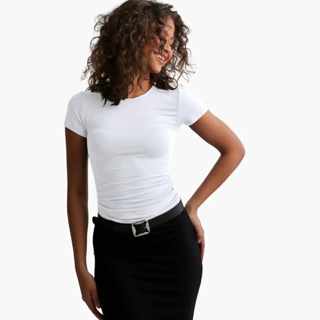 Women’s Slim Fit T-Shirt with Round Neck and Short Sleeves, white; paired with black skirt.