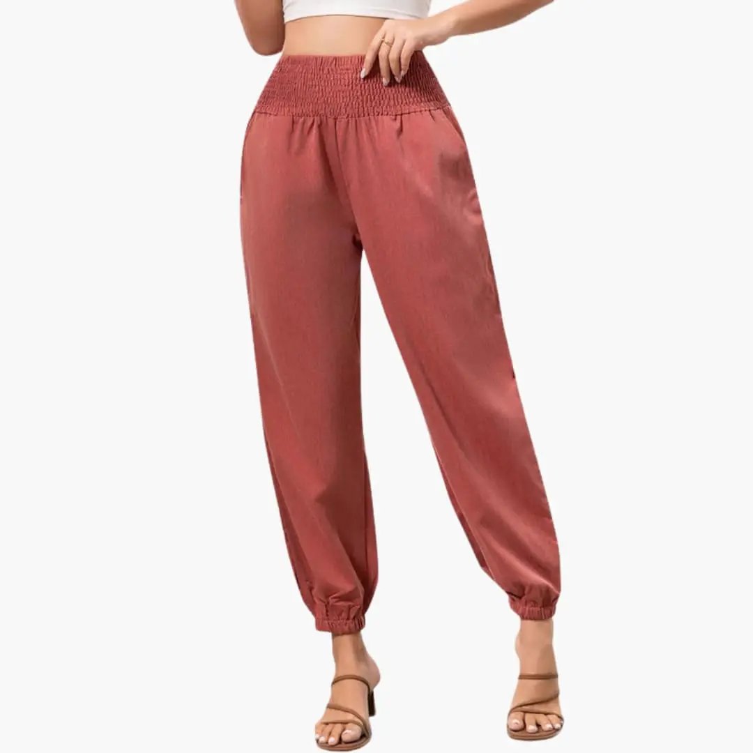 Women’s Summer Pants with elastic smocked waist and wide-leg silhouette in rust red.