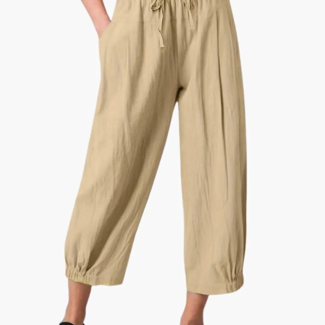 Women's summer pants by Wilfred Smith, beige loose-fit trousers with elastic waistband and cuffed hems.