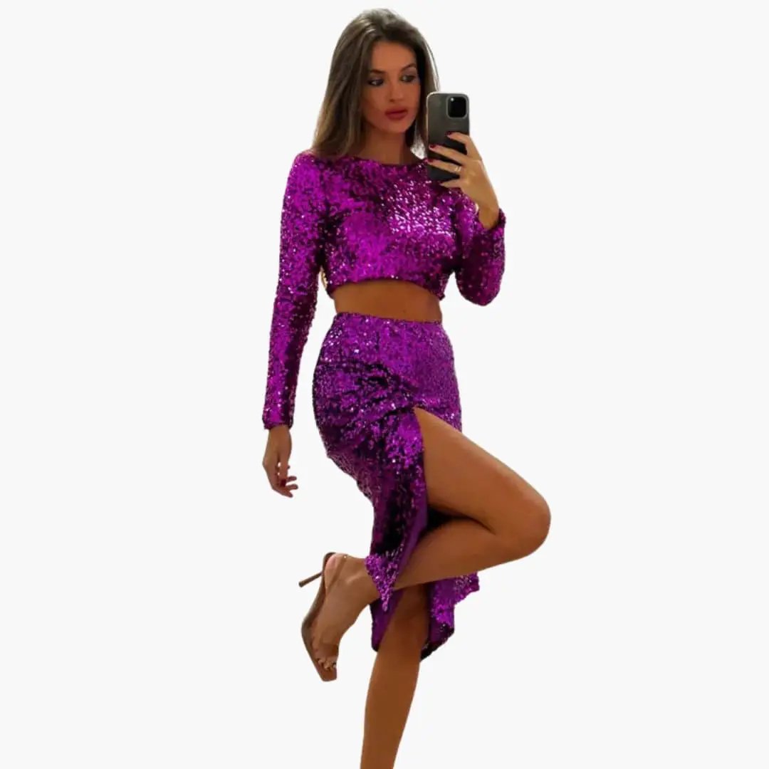 Women's two-piece purple sequin set with cropped long-sleeve top and high-slit mini skirt