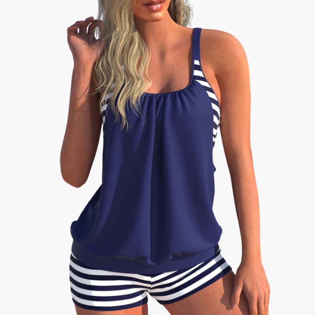 Women’s two-piece tankini swimsuit set with navy top and white/navy striped bottoms.