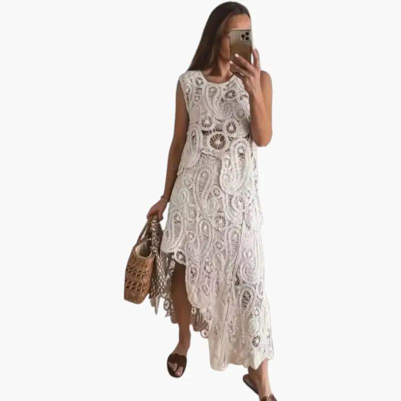 Women's two-piece set by Wilfred Smith in white openwork lace with an asymmetrical hem.
