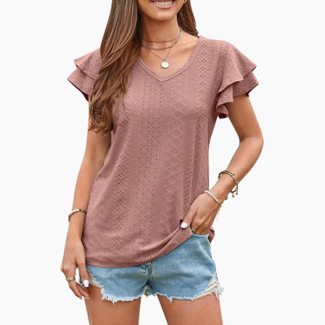 Women's V-neck eyelet textured T-shirt with ruffle short sleeves and curved hem in mauve pink.