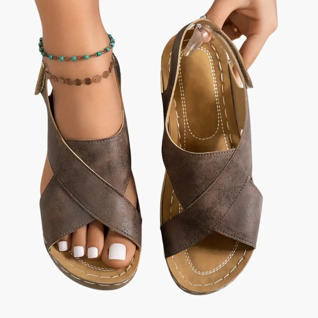 Women's wedge sandals by Wilfred Smith with cushioned footbed and platform sole, brown metallic cross-strap