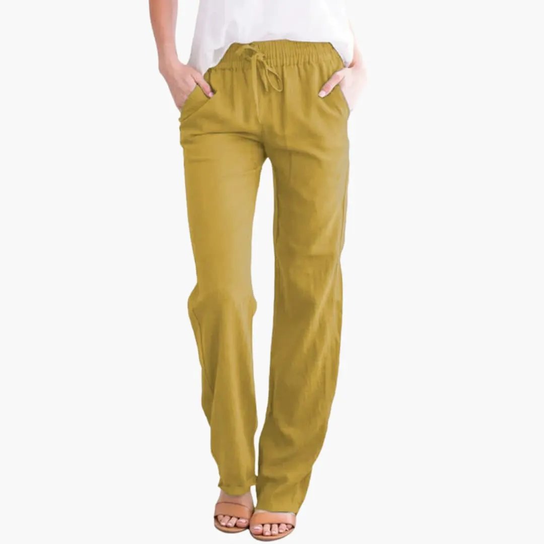 Women’s wide-leg pants in mustard yellow with elastic waistband, drawstring, and pockets.
