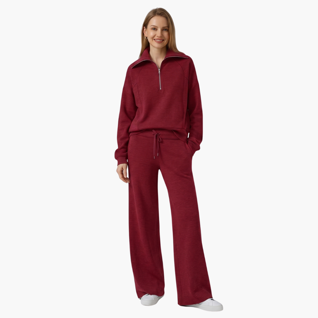 Women's lounge set by Wilfred Smith with burgundy half-zip top and wide-leg pants