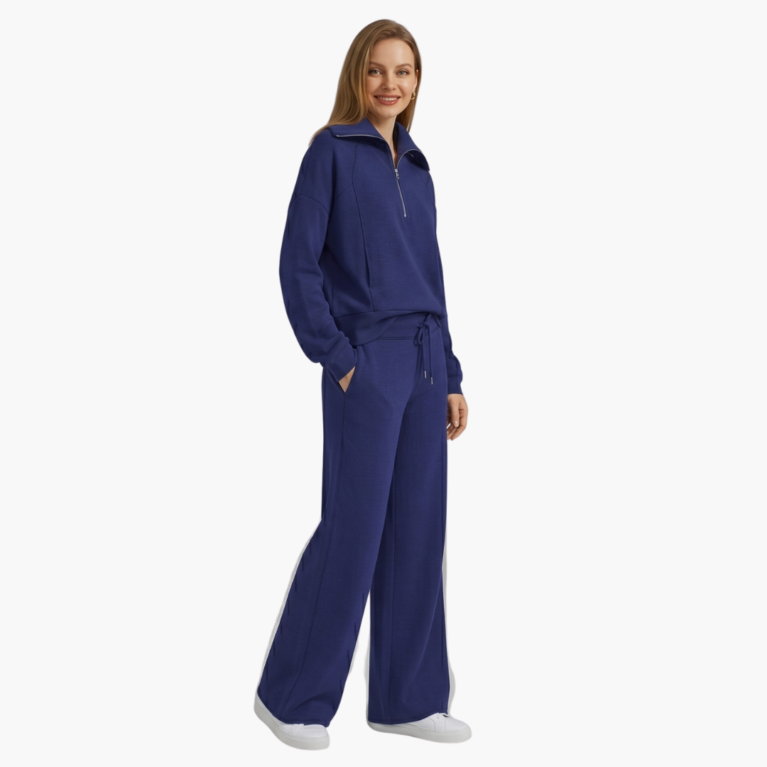 Women's two-piece lounge set with half-zip top and wide-leg pants in royal blue.