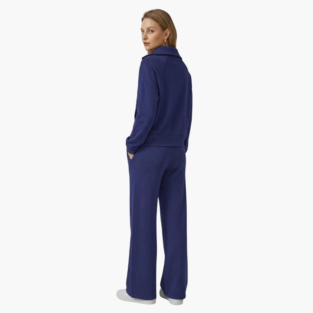 Women's two-piece lounge set with half-zip top and wide-leg pants in blue by Wilfred Smith