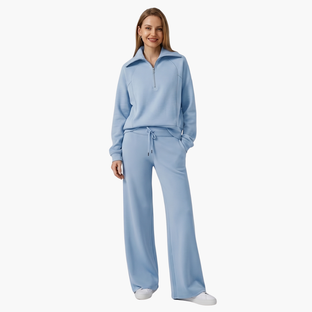 Women's lounge set with half-zip top and wide-leg pants in light blue.