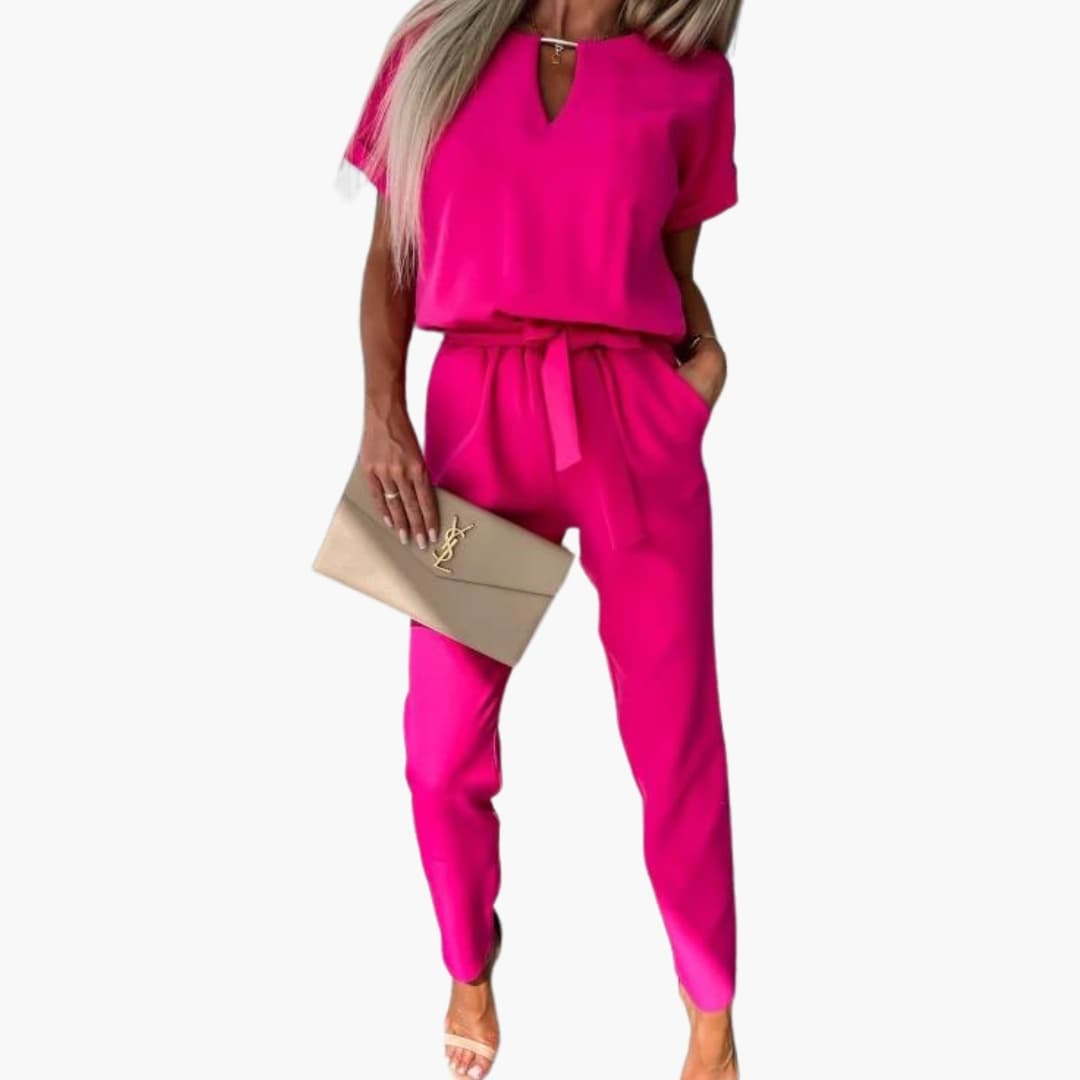Women’s V-neck magenta jumpsuit with waist belt; one-piece by Wilfred Smith